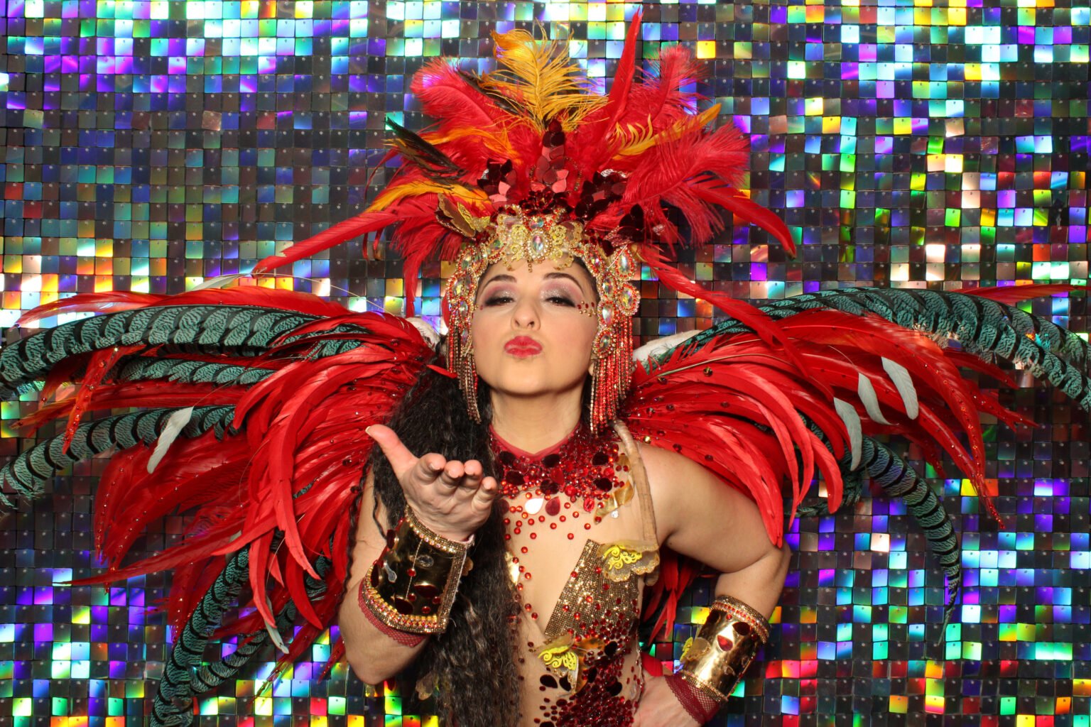 Guests on a sequin wall at a carnival party