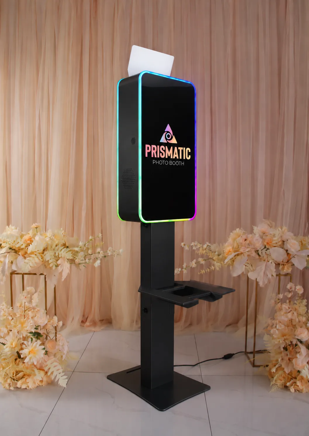The Prismatic photo booth with its glowing LED frame, set up for a wedding