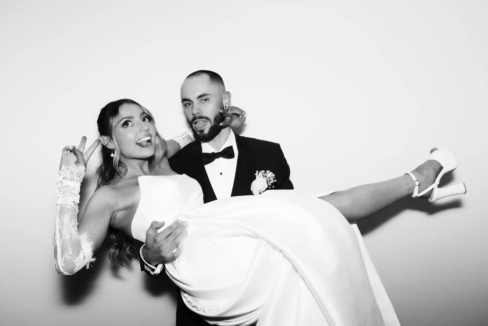 Guests at a Prismatic wedding photo booth